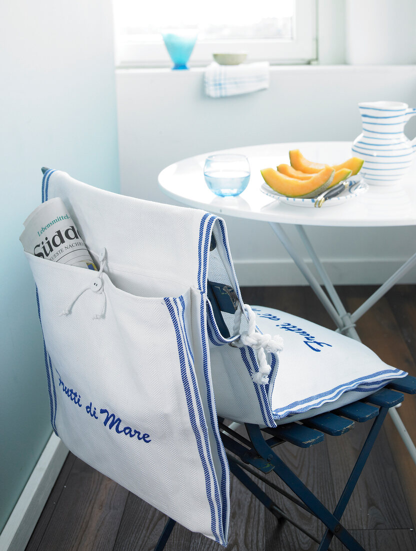 Garden chair with slipcovers in blue and white from tea towels