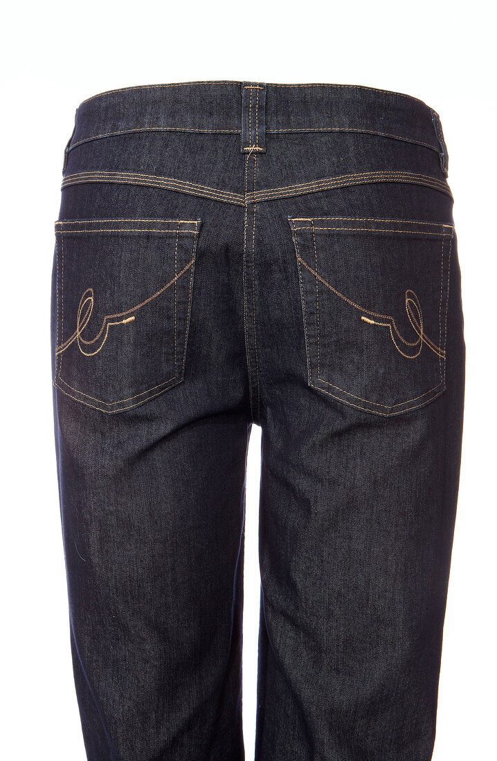 Rear View of dark blue jeans on white background