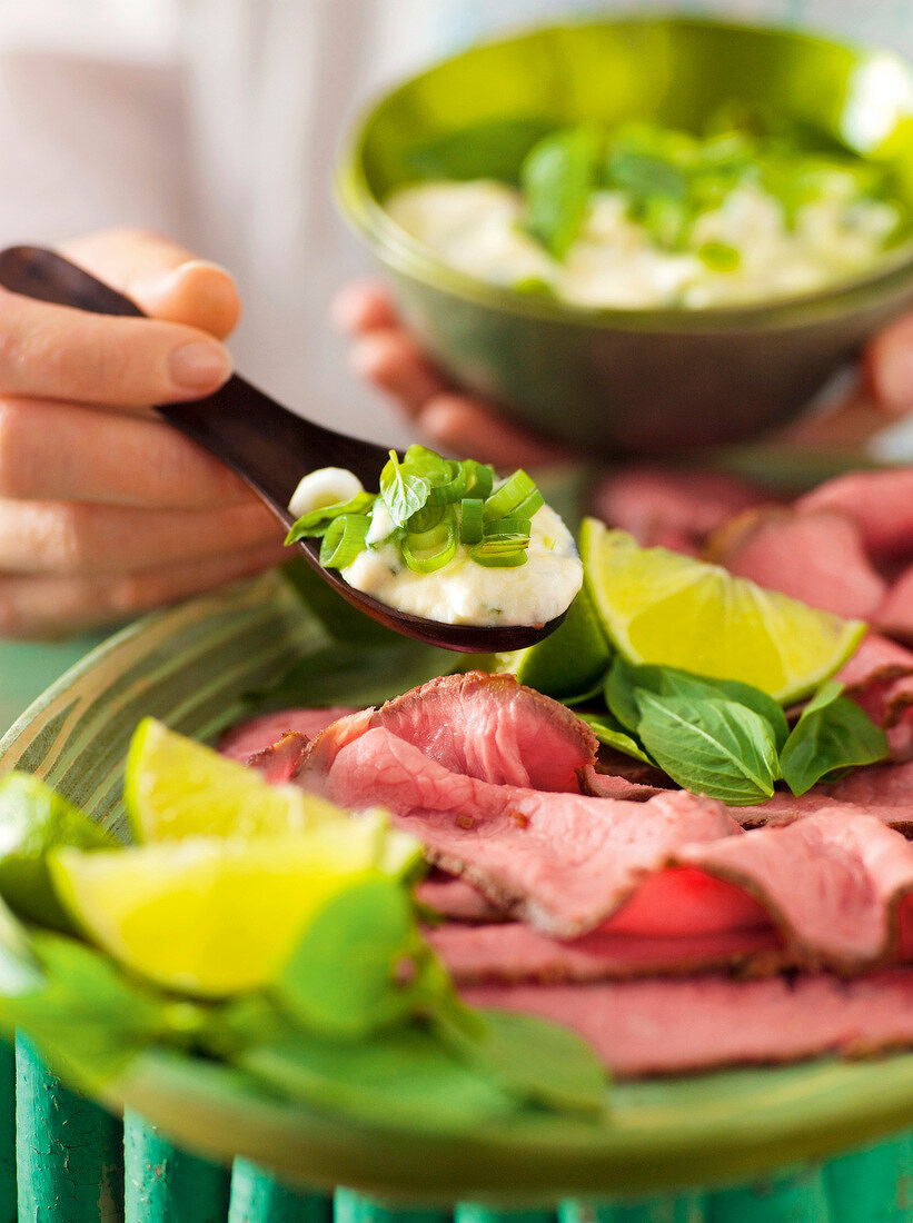 Close-up of Asian roast beef with remoulade Thai on plate