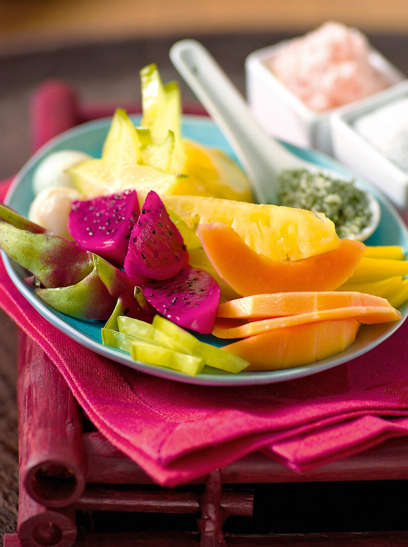 Exotic fruit salad with spiced and on plate