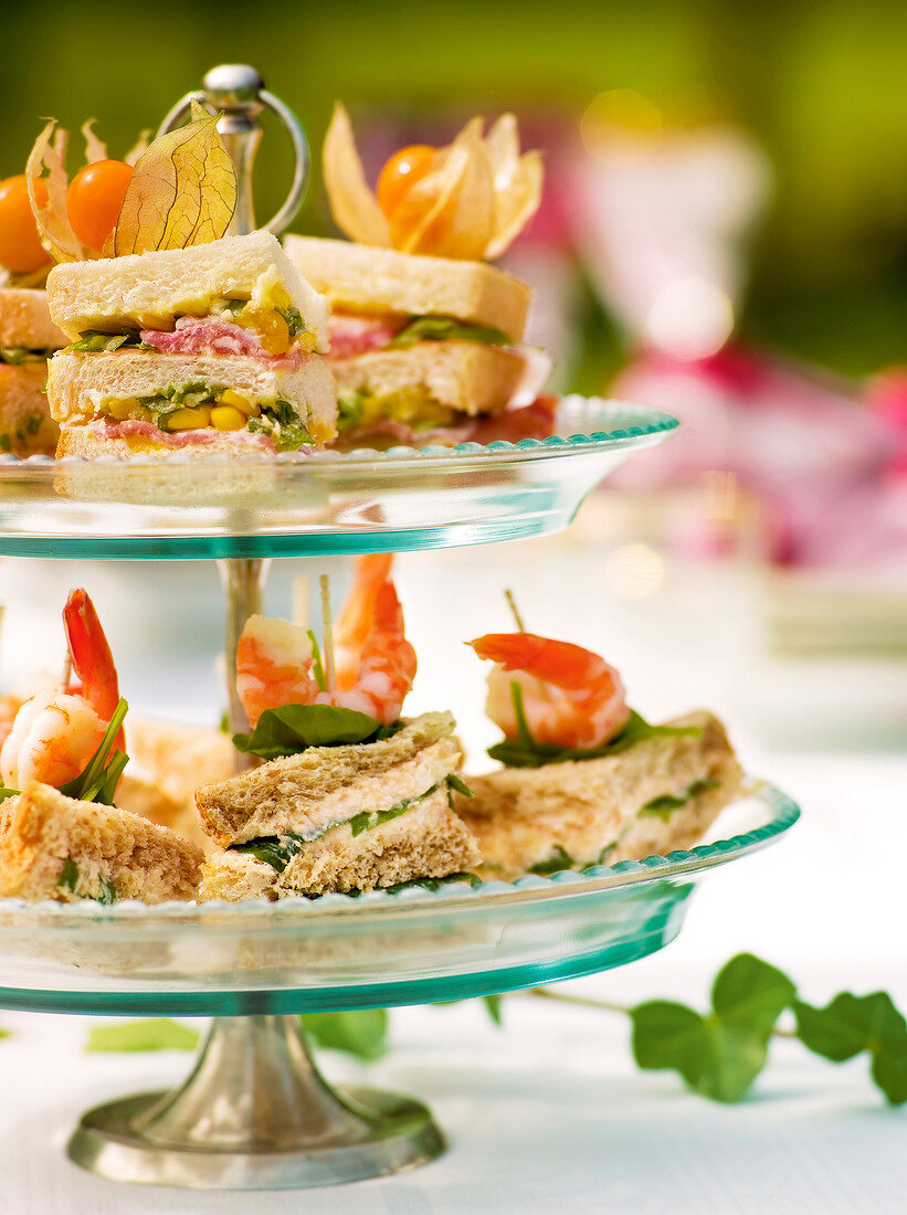 Close-up of dainty sandwiches on cake stand