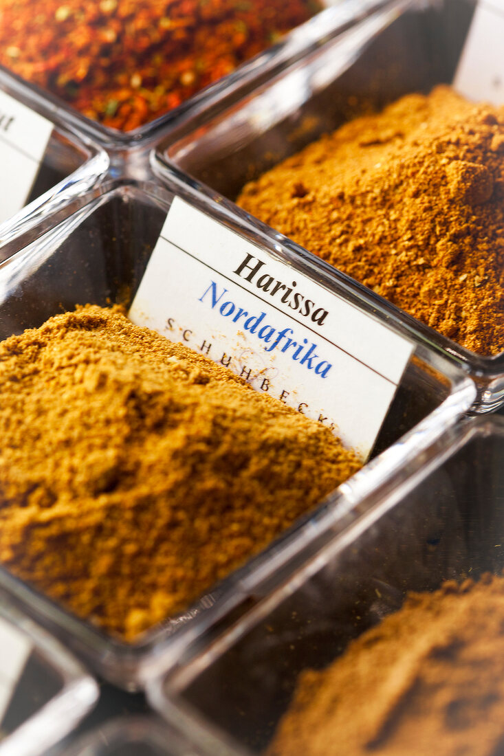 Various spices in glass bowls