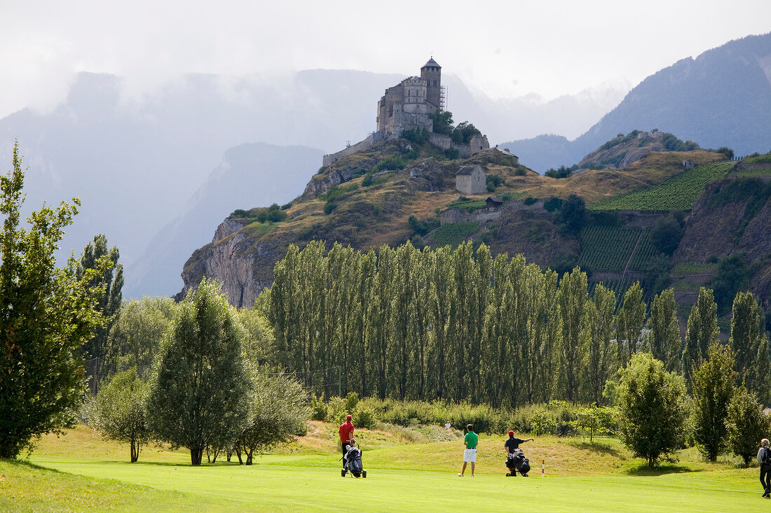 View of golf course overlooking Valere castle in Valais, Switzerland