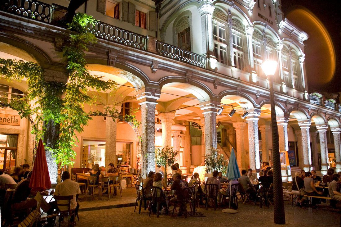 Illuminated cereals market with arcades at night in Valais, Sion, Switzerland