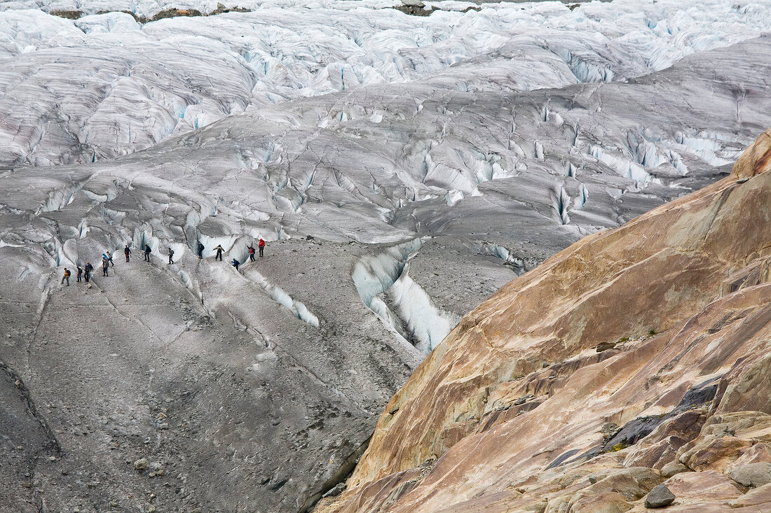 Hikers in Aletsch Glacier, Marjelesee, Valais, Switzerland