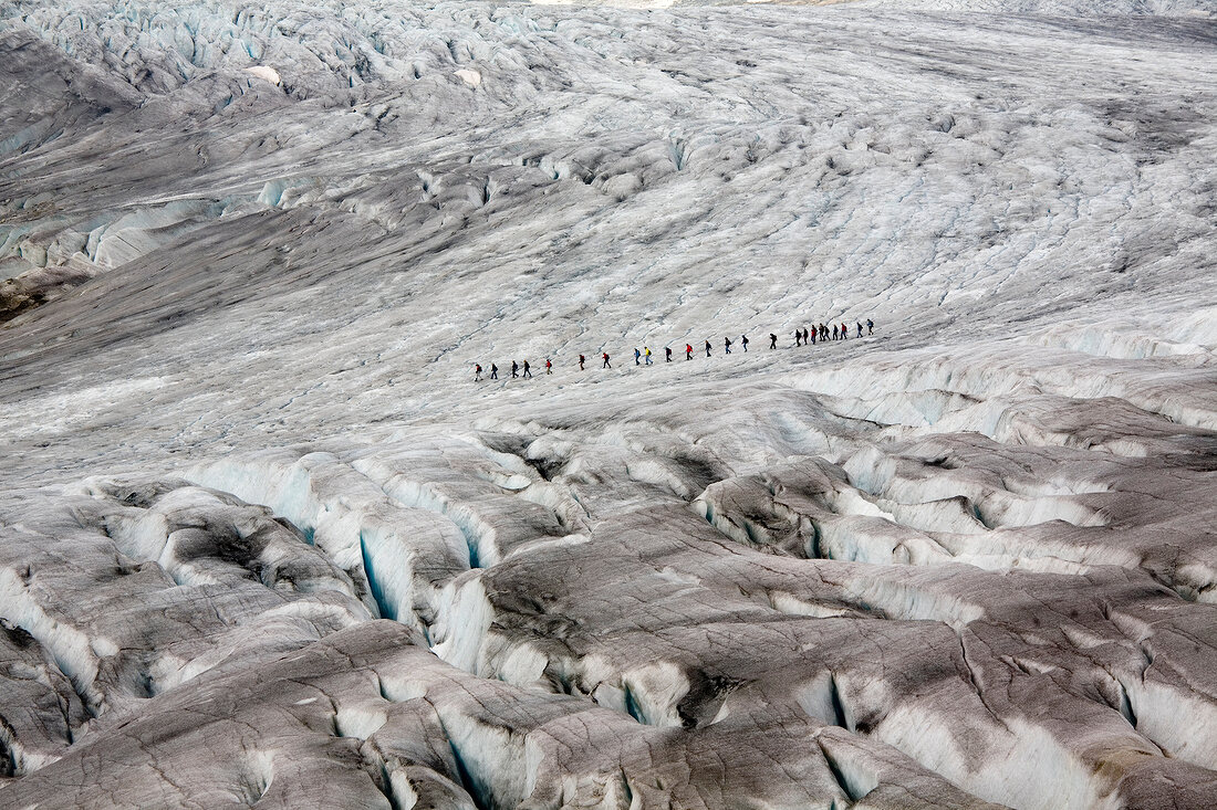 Hikers in Aletsch Glacier, Marjelesee, Valais, Switzerland