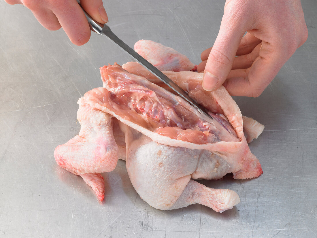 Cutting raw chicken, step 1