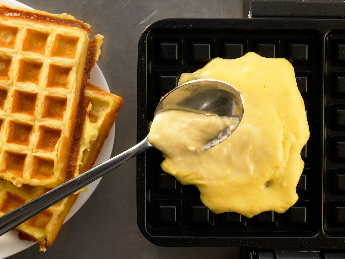 Putting batter of potato waffles in waffle mould, step 3