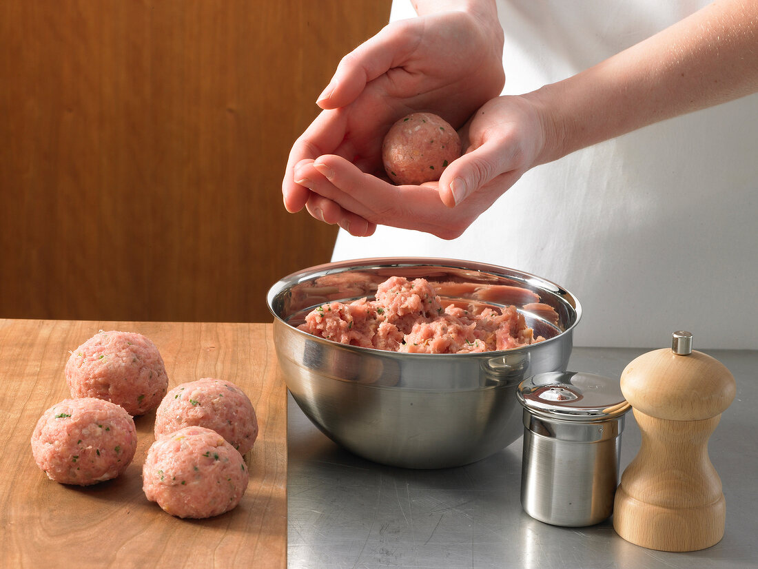 Making small meatballs with meatball mixture, step 2