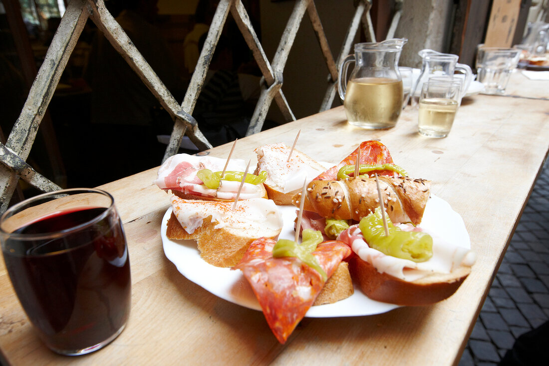 Appetizers with sausage and pepperoni on plate, South Tyrol, Bolzano