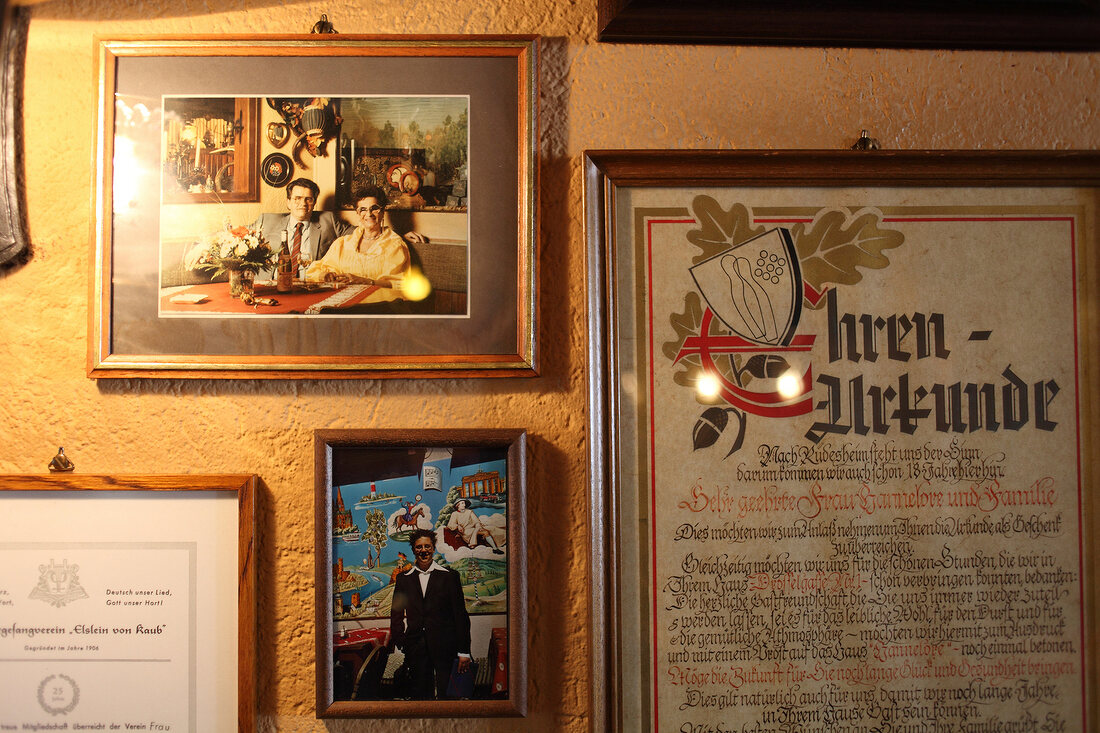 Close-up of pictures of landlady Hannelore Behrens on wall in Rudesheim, Germany