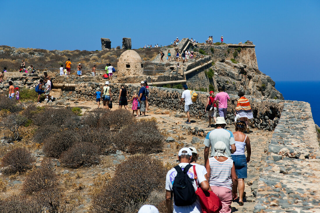 Tourists at Venetian fortress in Crete, Greek 