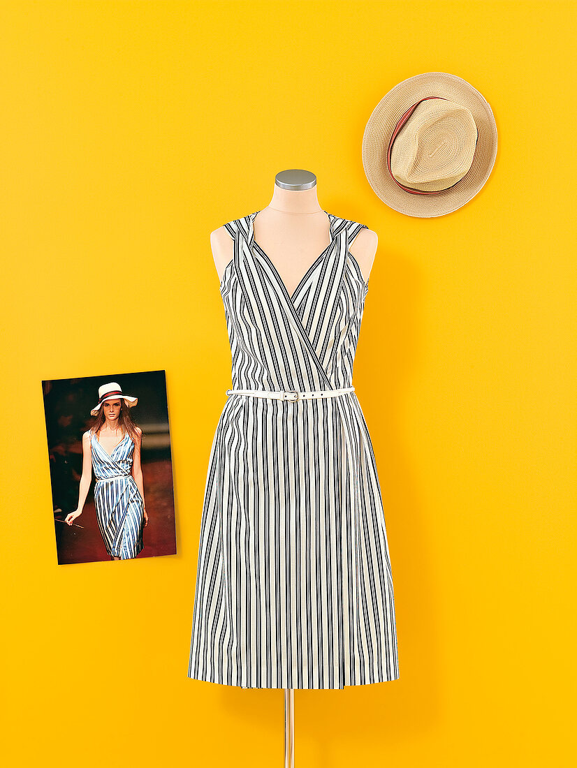 Black and white dress on mannequin and hat with catwalk photo