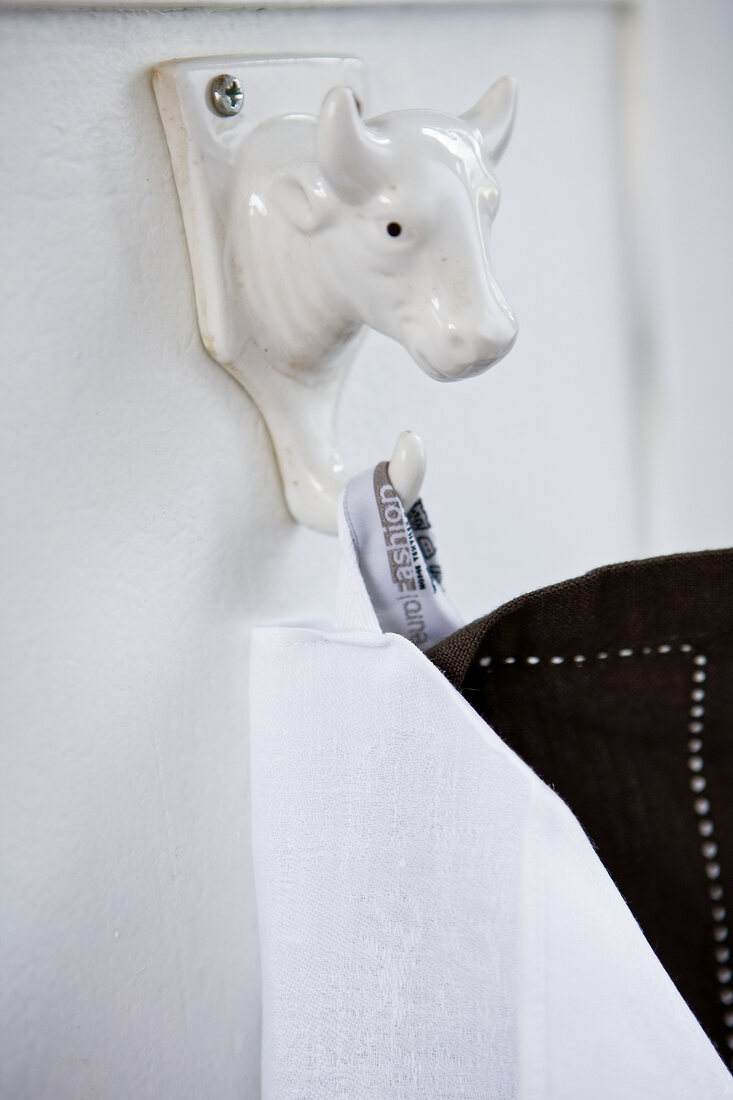 Close-up of white holder in animal shape in bathroom