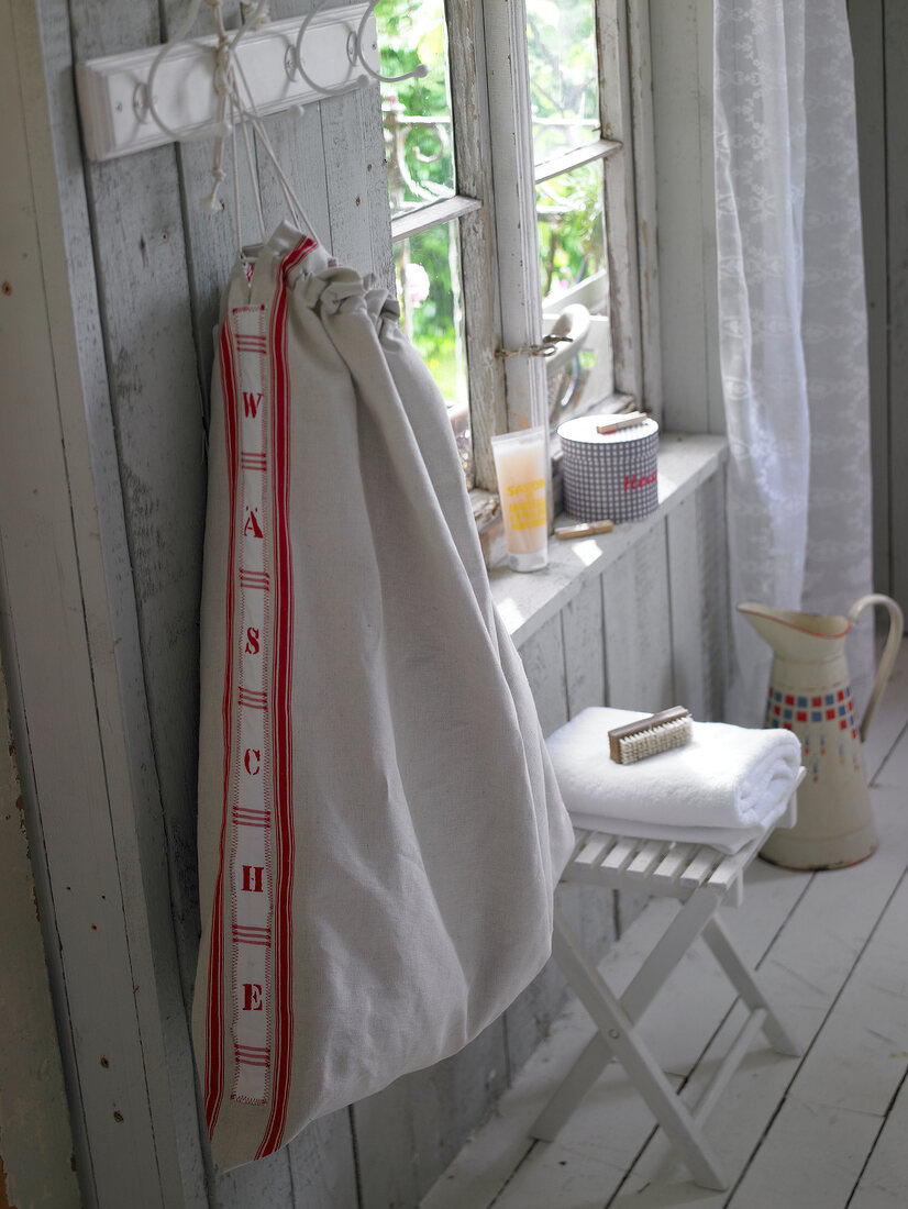 Laundry bag hanging in bathroom