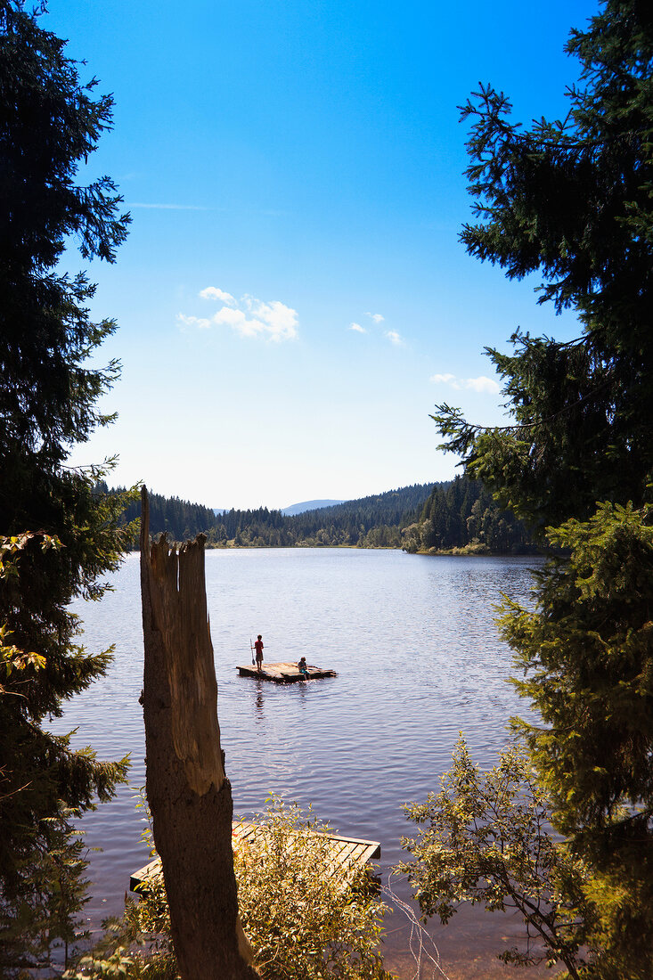 View of children on raft in lake of Black Forest, Germany