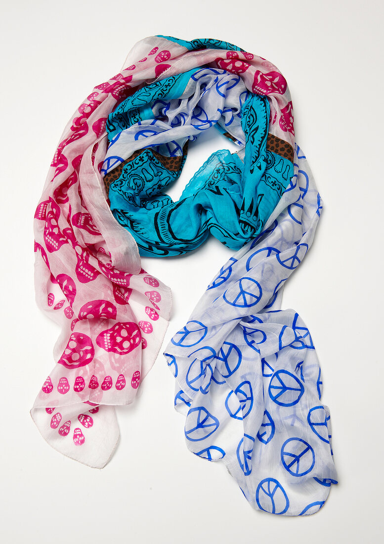 Three silk motif patterned scarf on white background