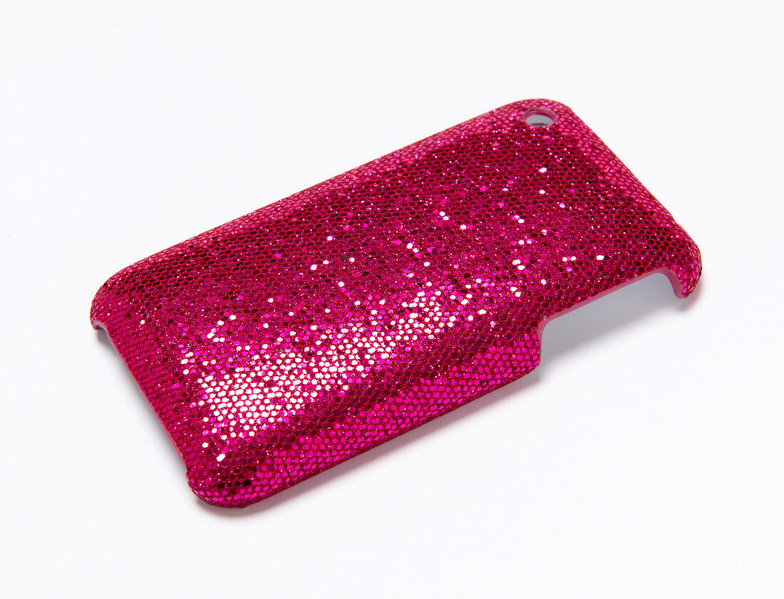Close-up of pink mobile case on white background
