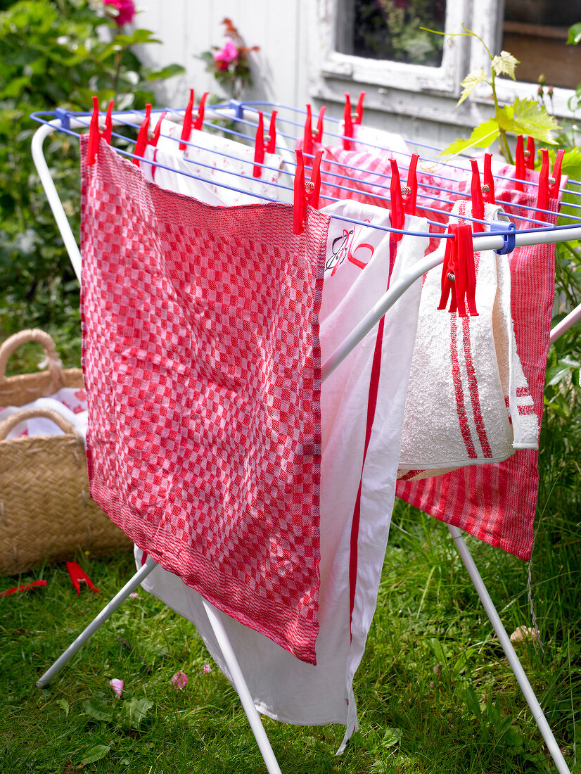 Drying rack with towels and tea towels in garden