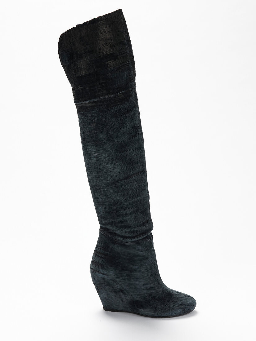 Long black boots with wedge on white background