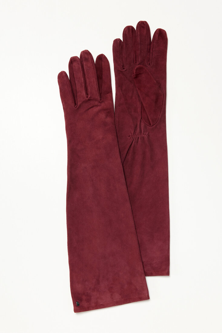 Long red suede gloves on white background