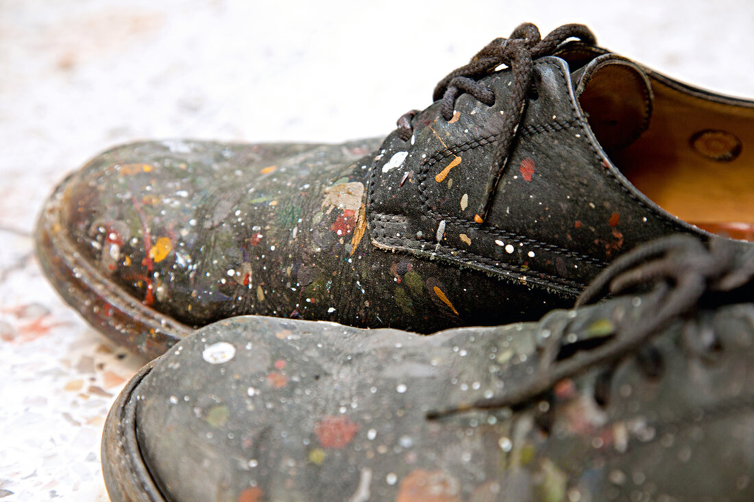 Close-up of black man shoes with farbkleckse
