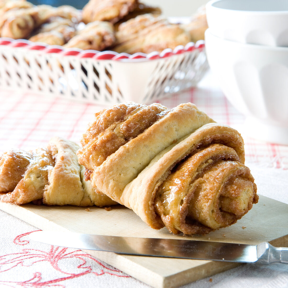 Close-up of cinnamon roll on chopping board