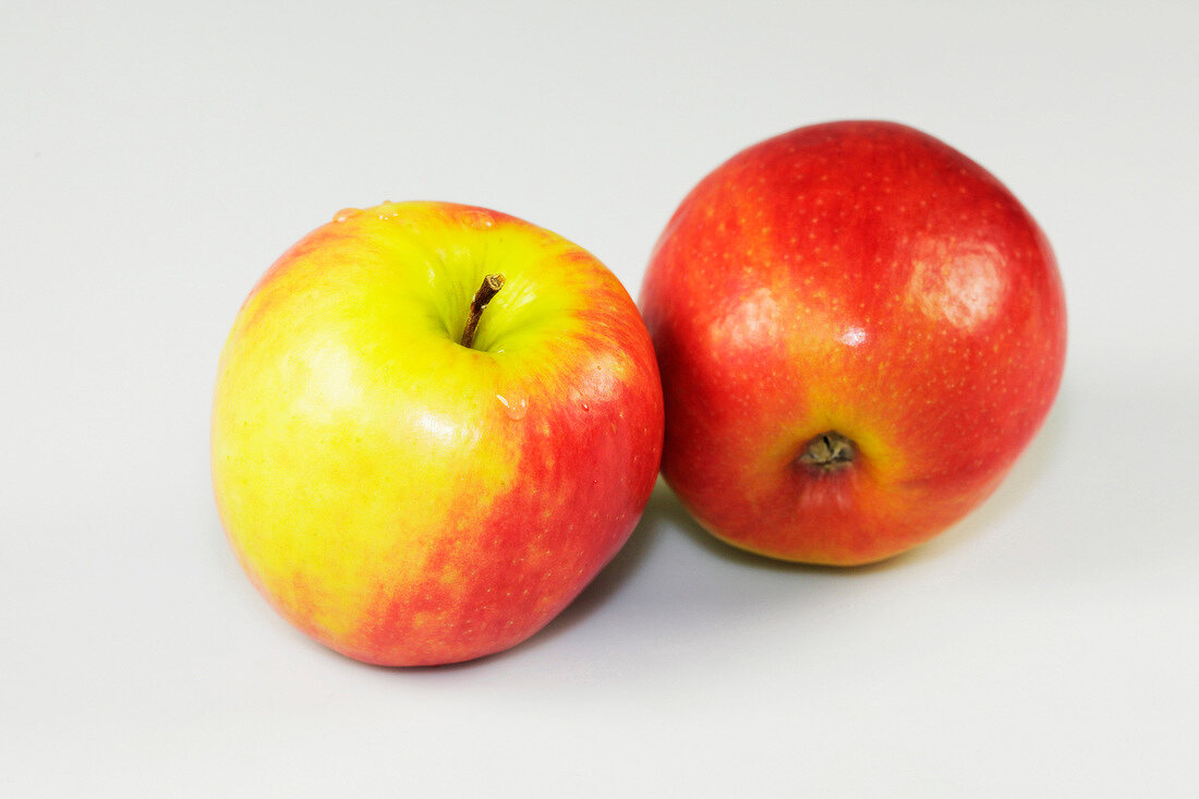 Close-up of two apples on white background