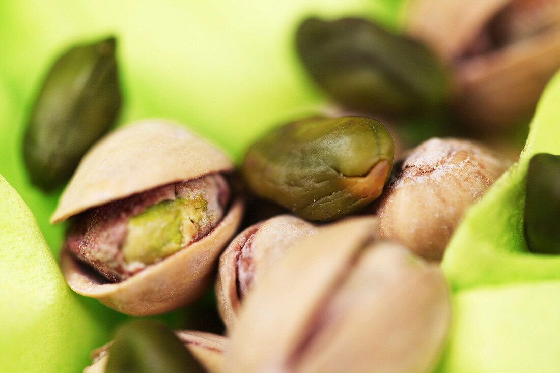 Close-up of pistachios on white background