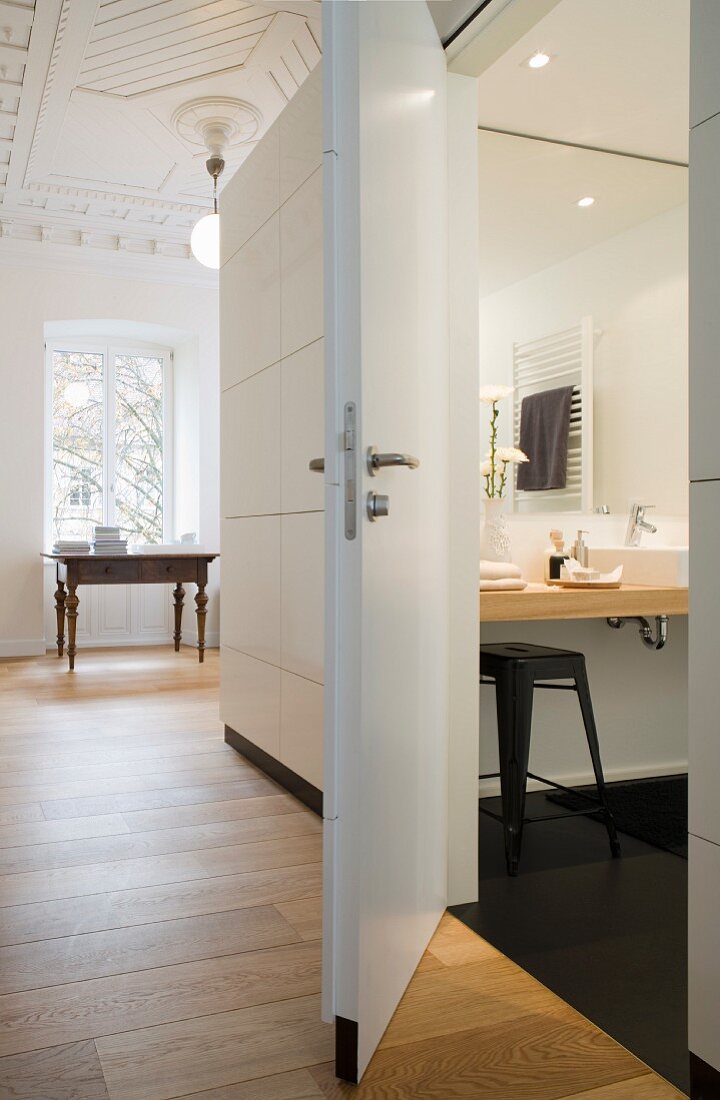 A view into a bathroom in an apartment in a period building