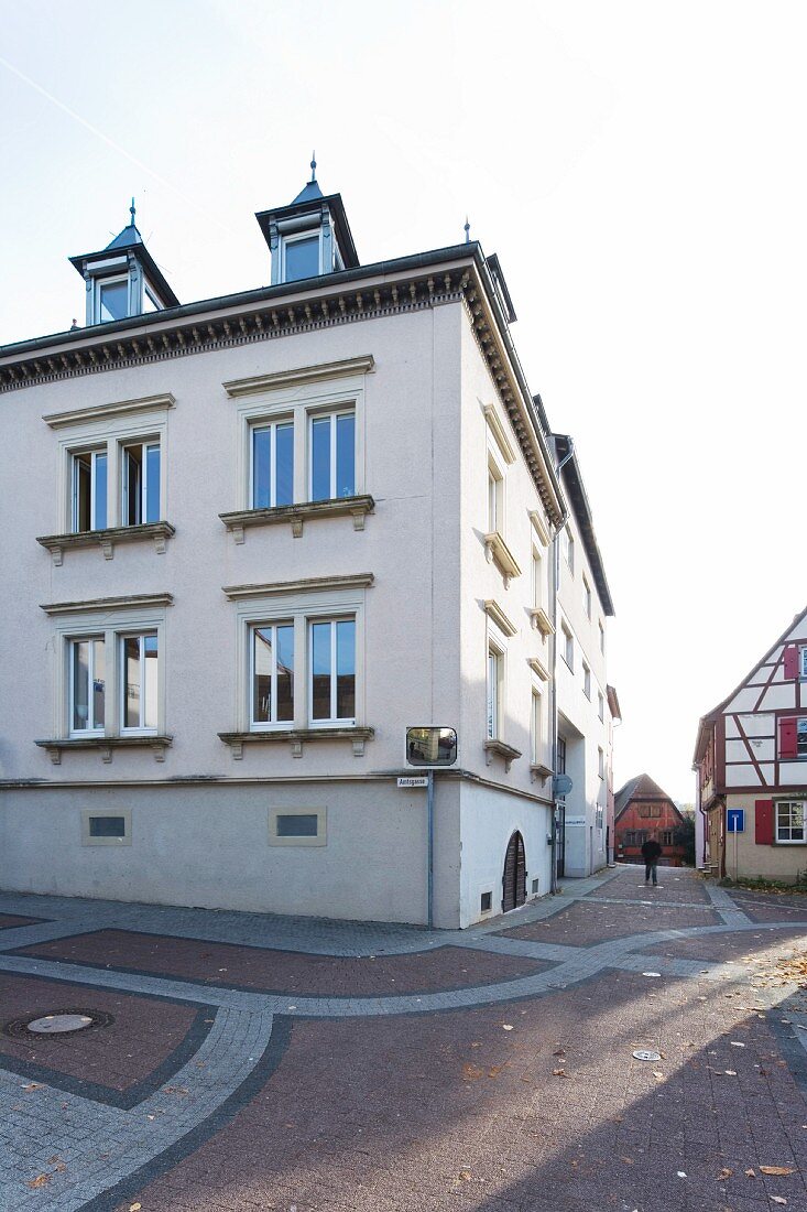 An old town house with a basement in a pedestrian area