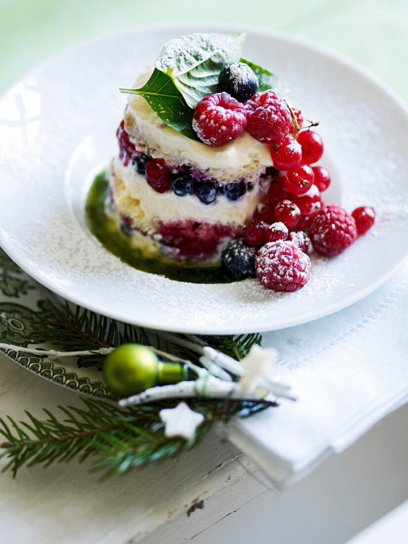 Tiramisu tartlet with berries and sweet basil sauce