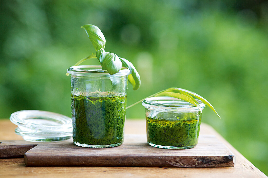 Close-up of basil, chives and wild garlic paste in jars