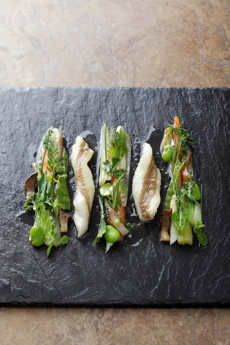 Fish and vegetables on a slate plate