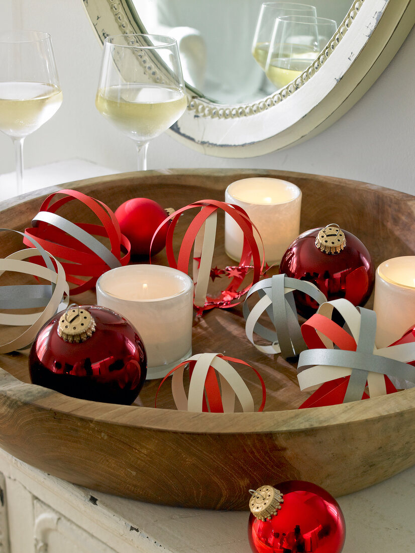 Decorative balls from paper stripe in bowl