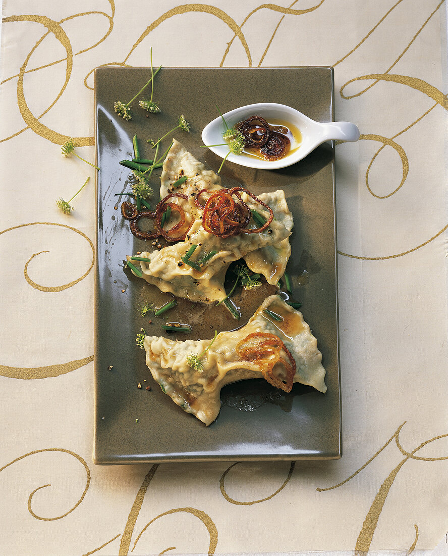 Swabian ravioli with brown butter on plate