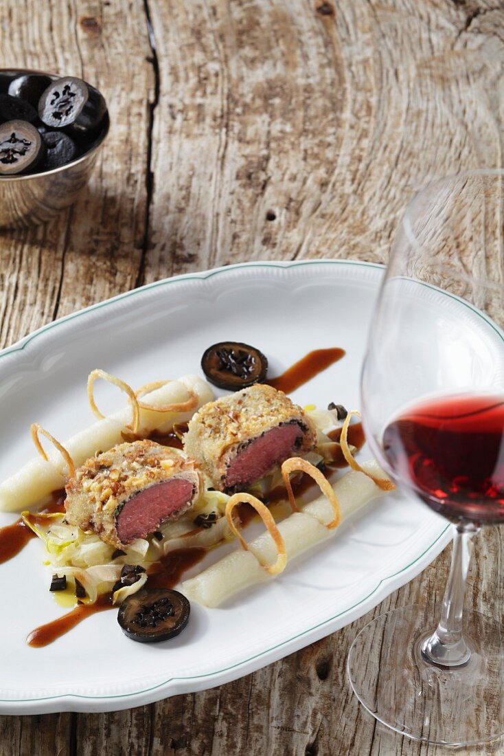 Hare with black nuts in serving dish