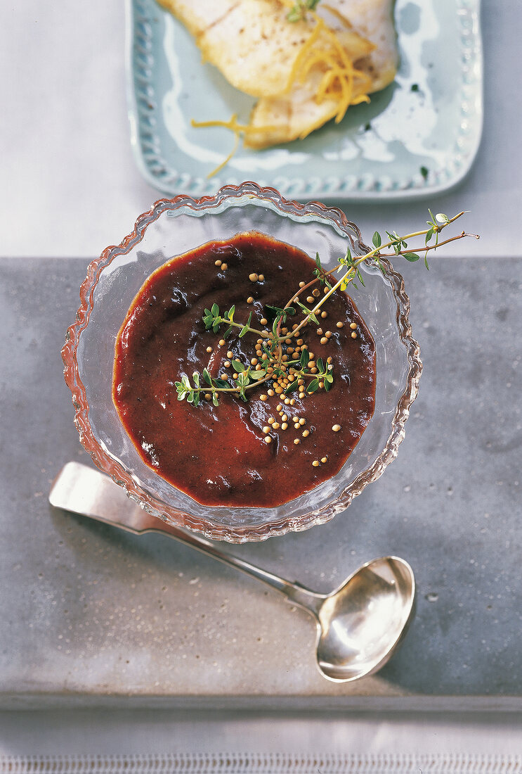 Sloes cream with mustard in glass bowl