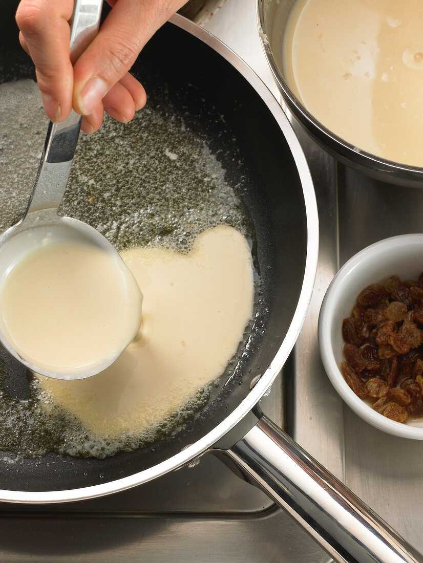 Pouring pancake mixture in pan for preparation of pancakes, step 1