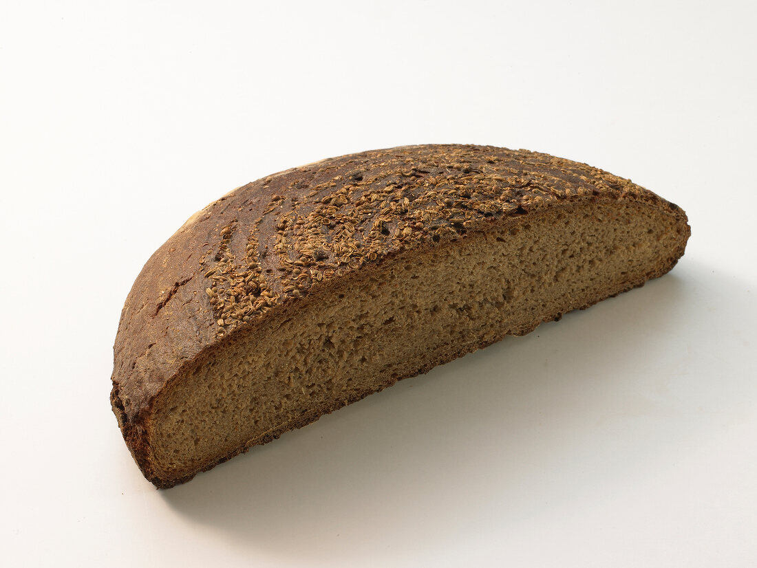 Close-up of spiced bread on white background