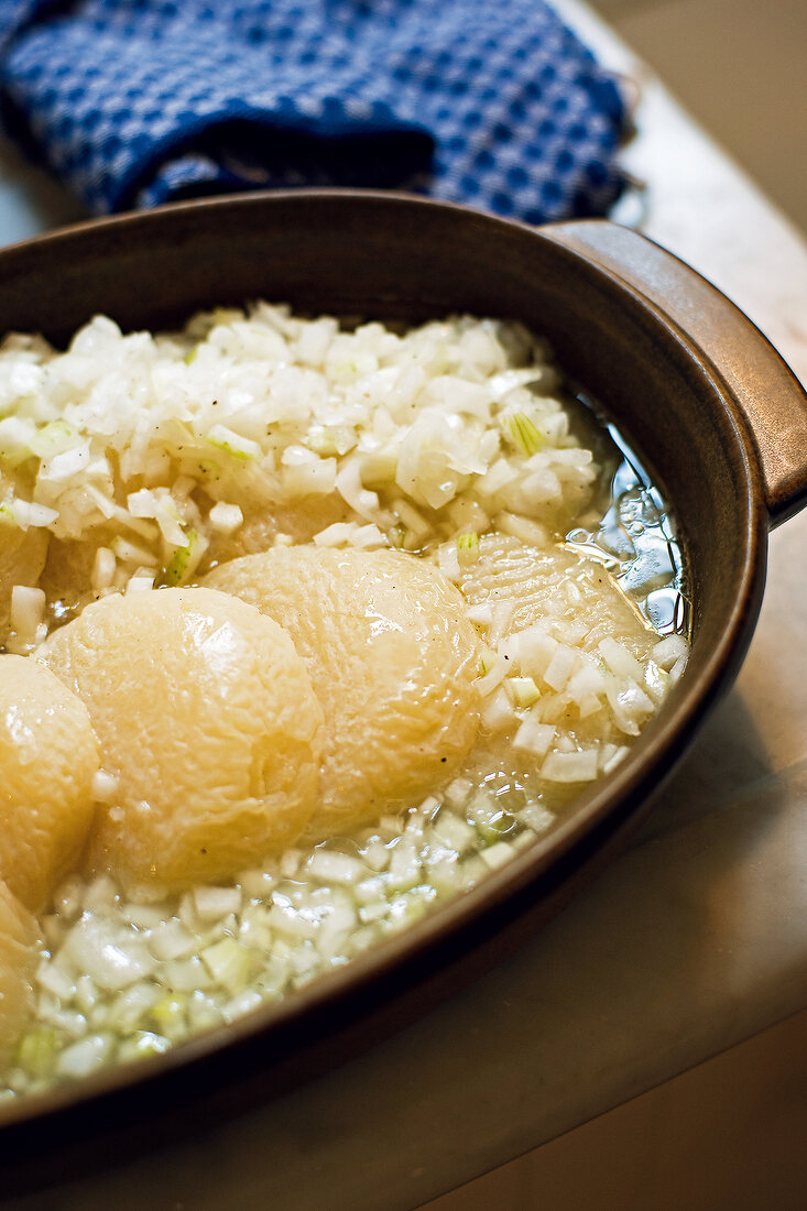 Hand cheese with onions in casserole