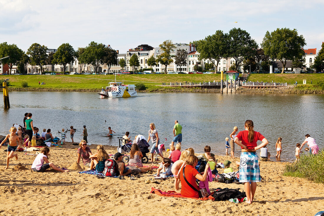 People in Weser beach, Bremen, Germany