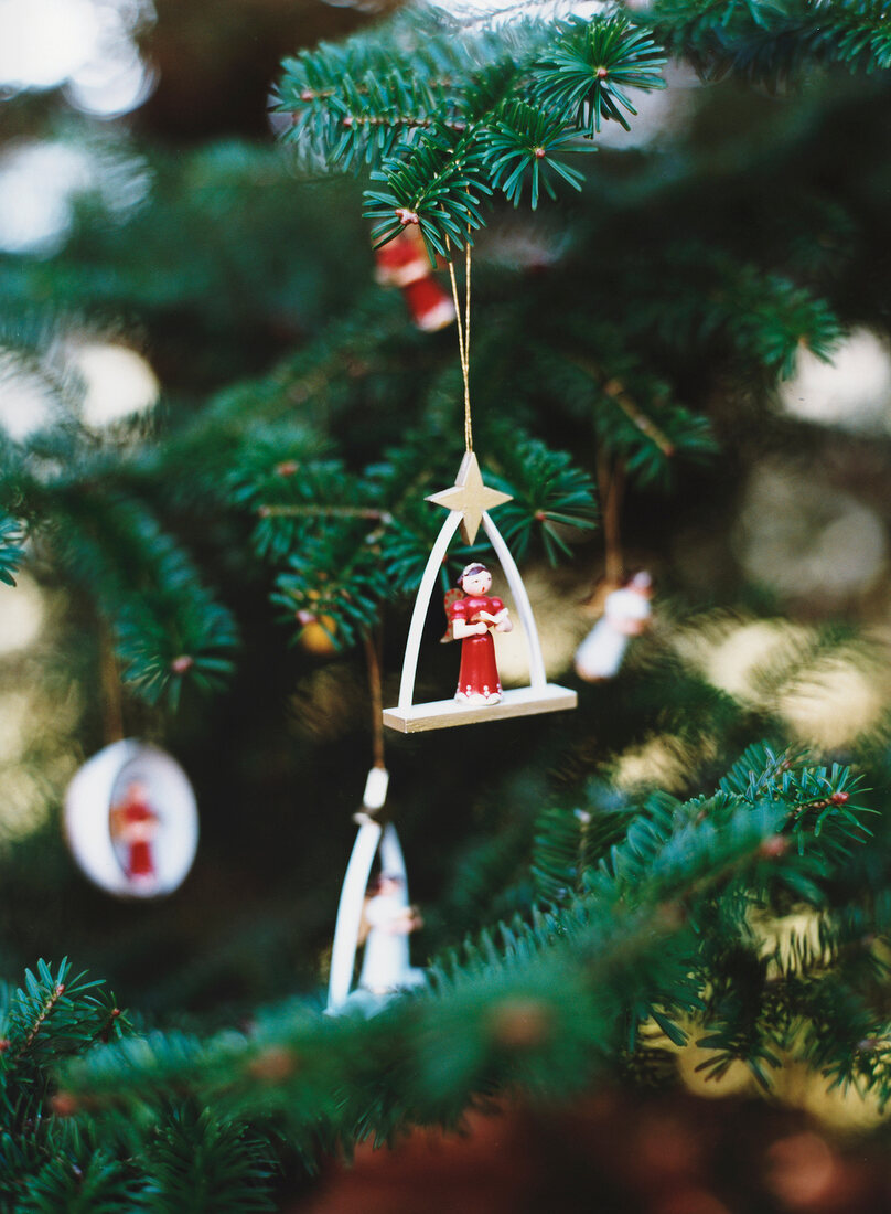 Close-up of wooden ornaments on Christmas tree