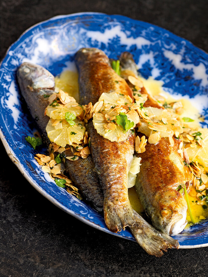 Trout meuniere with brown almond butter on plate