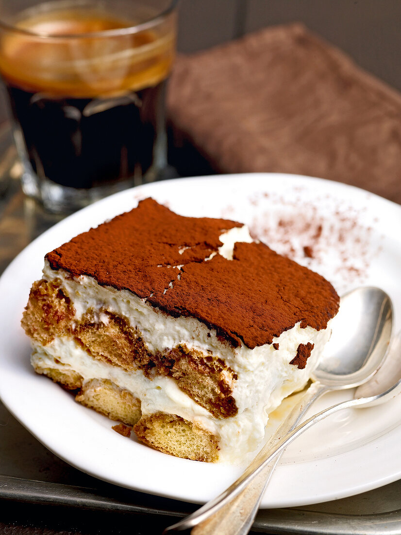 Close of piece tiramisu with amaretto on plate