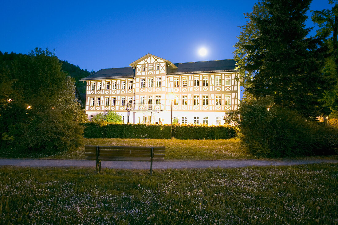 View of illuminated house at dusk in Franconian Switzerland, Bavaria, Germany