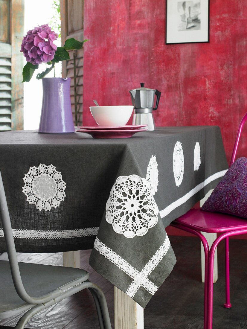 Table cloth decorated with appliqué, crocheted doilies