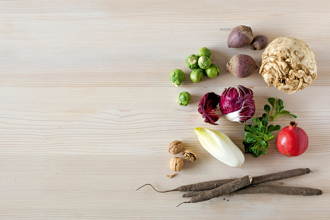 Different types of fruits and vegetables on wooden surface, overhead view