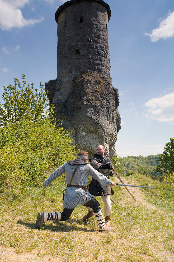Two knights in front of small tower in Franconian Switzerland, Bavaria, Germany