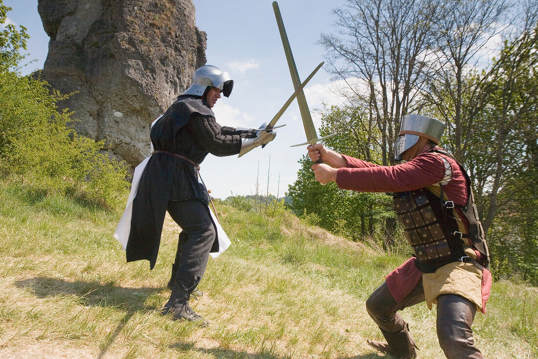 Two knights in front of small tower in Franconian Switzerland, Bavaria, Germany